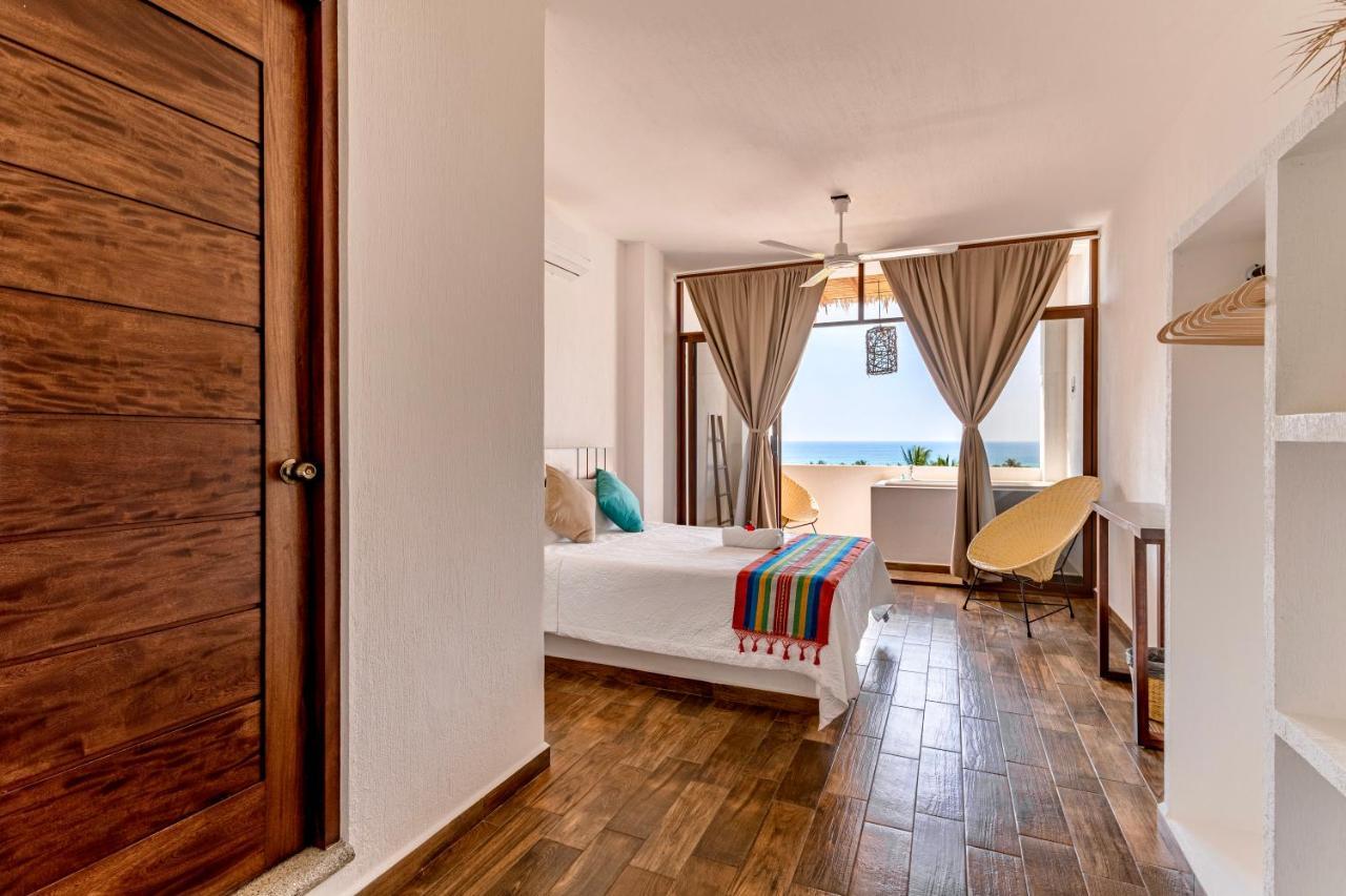 Habitación Doble Deluxe con balcón y vistas al mar